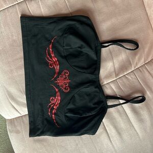 Black small/medium cropped tank top with inseam in front and red design